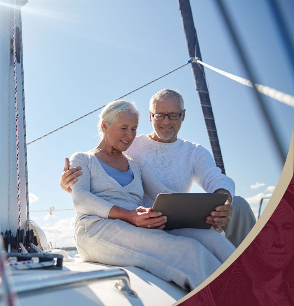 Retired couple looking at tablet