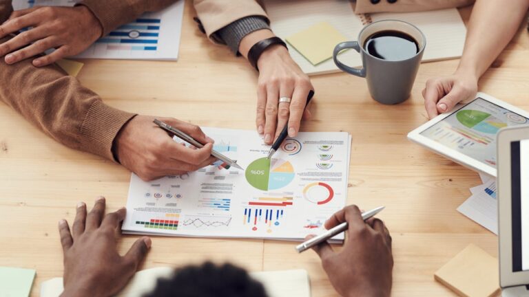 people reviewing asset allocation report documents